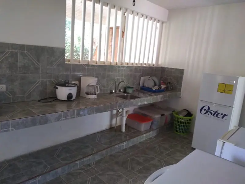 Kitchen with tiled counter and window