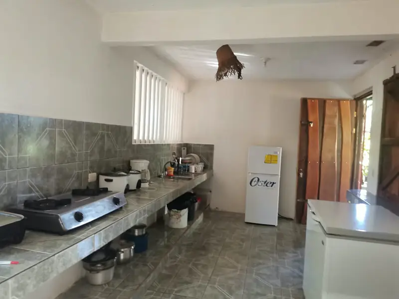 Kitchen with stove and refrigerator