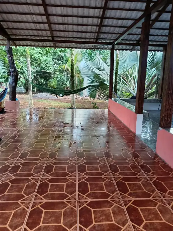 Tiled terrace opening to the garden